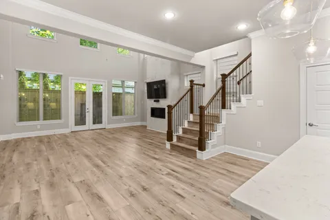 a view of an entryway with wooden floor