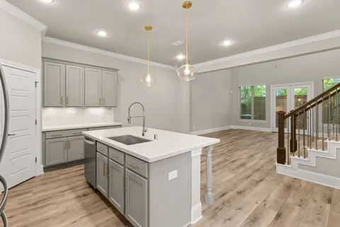 a kitchen with a sink and stove
