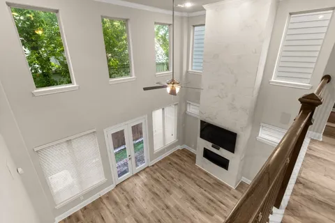 a view of a livingroom with furniture and a window