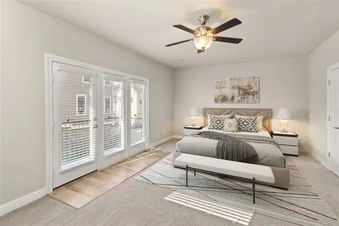 a spacious bedroom with a bed and a large window