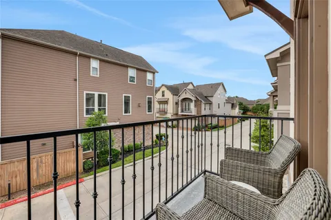 a view of a brick wall with a roof deck