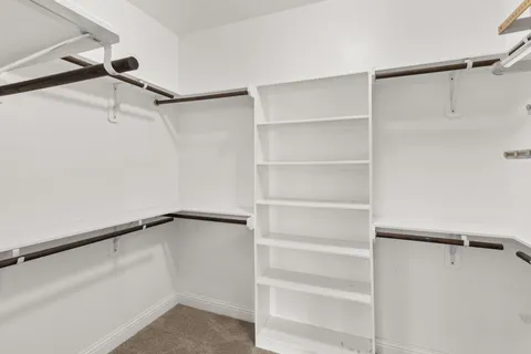 a view of an empty walk in closet