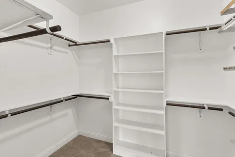 a view of an empty walk in closet