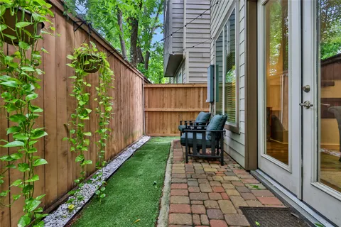 a view of a back yard from a balcony
