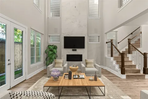 a view of a livingroom with furniture and a flat screen tv