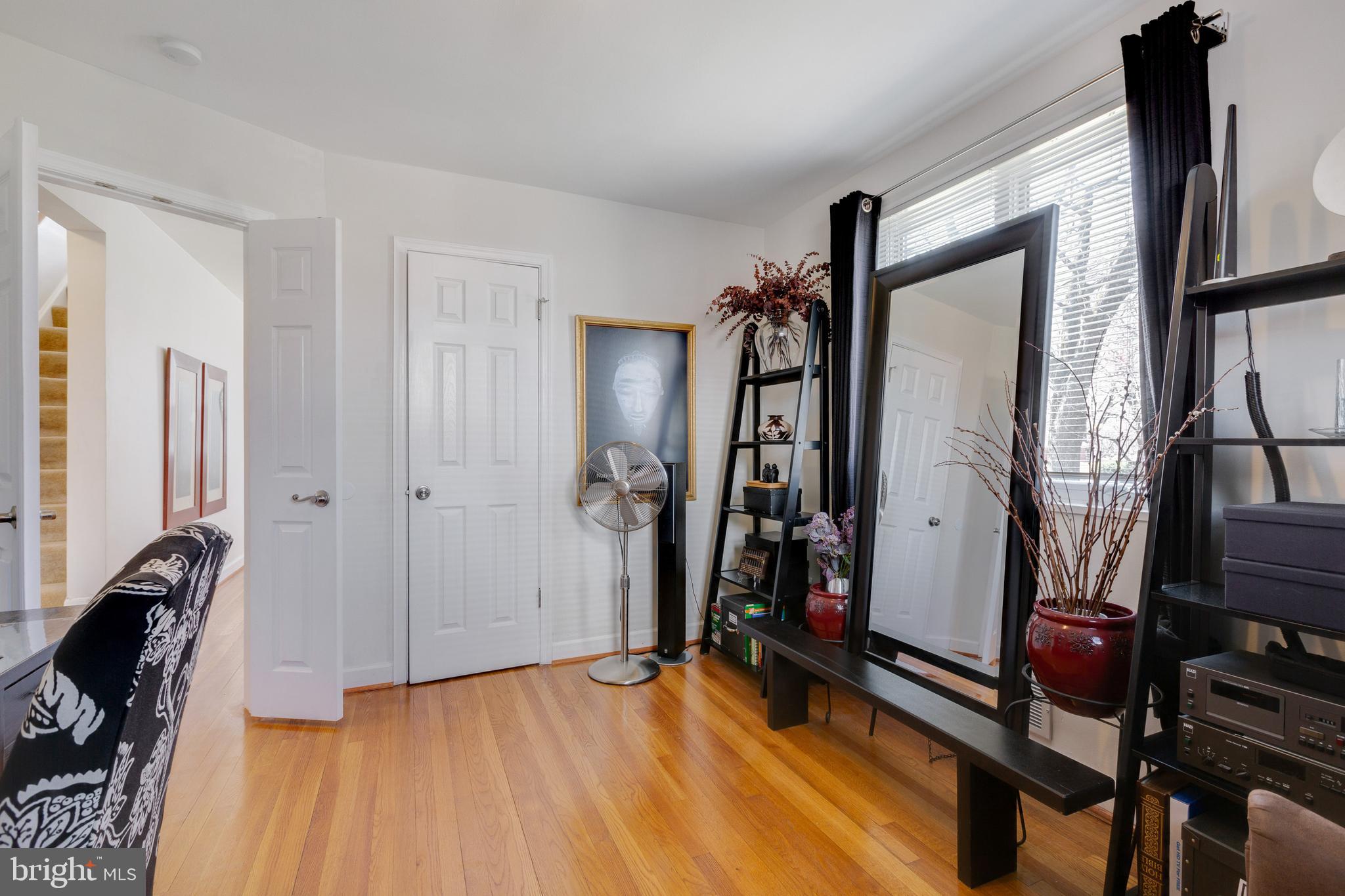 3903 Gannon Road Silver Spring, MD 20902 - Photo 11 of 51 a view of a hallway with wooden floor and stairs
