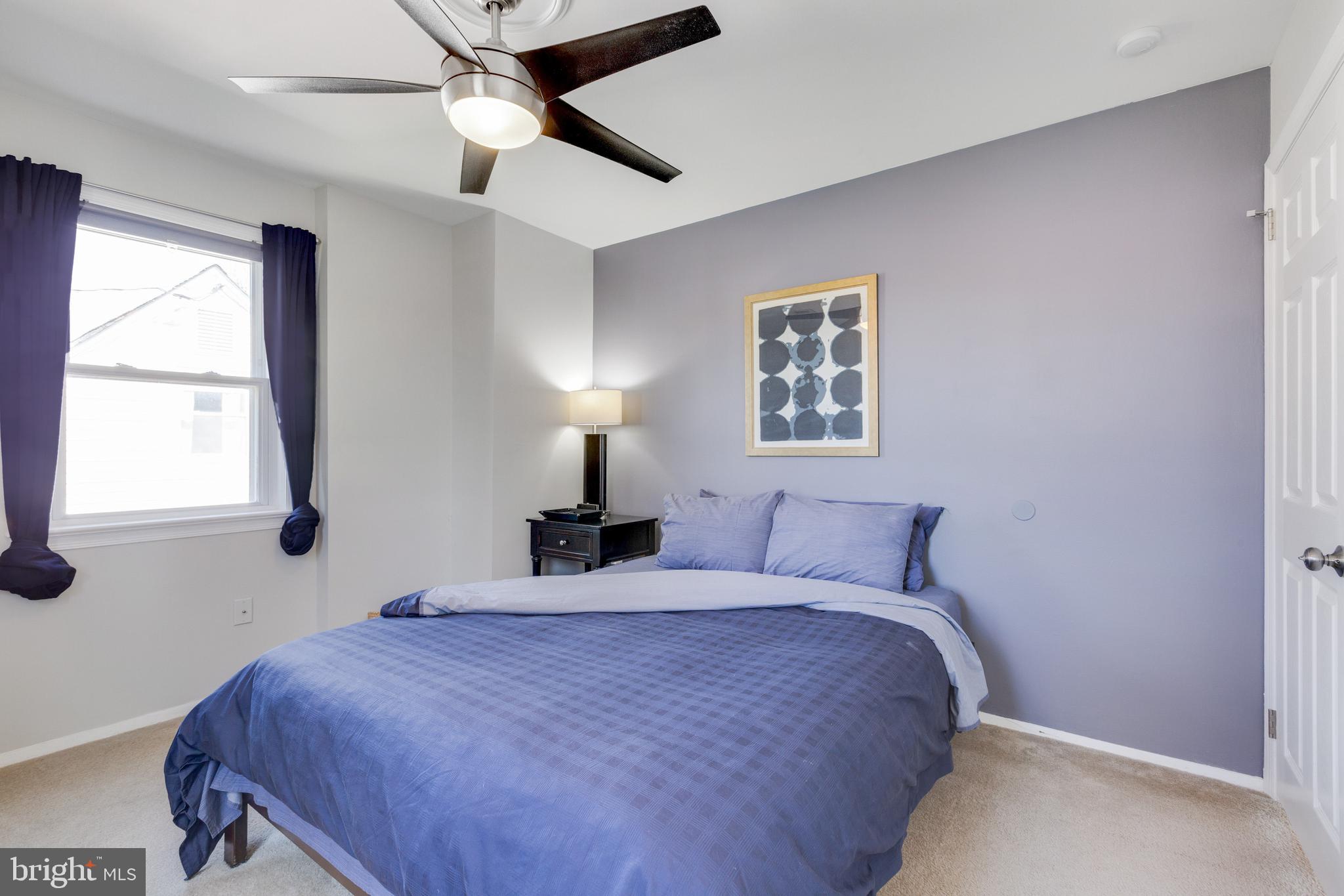 3903 Gannon Road Silver Spring, MD 20902 - Photo 15 of 51 a bedroom with a bed and a window