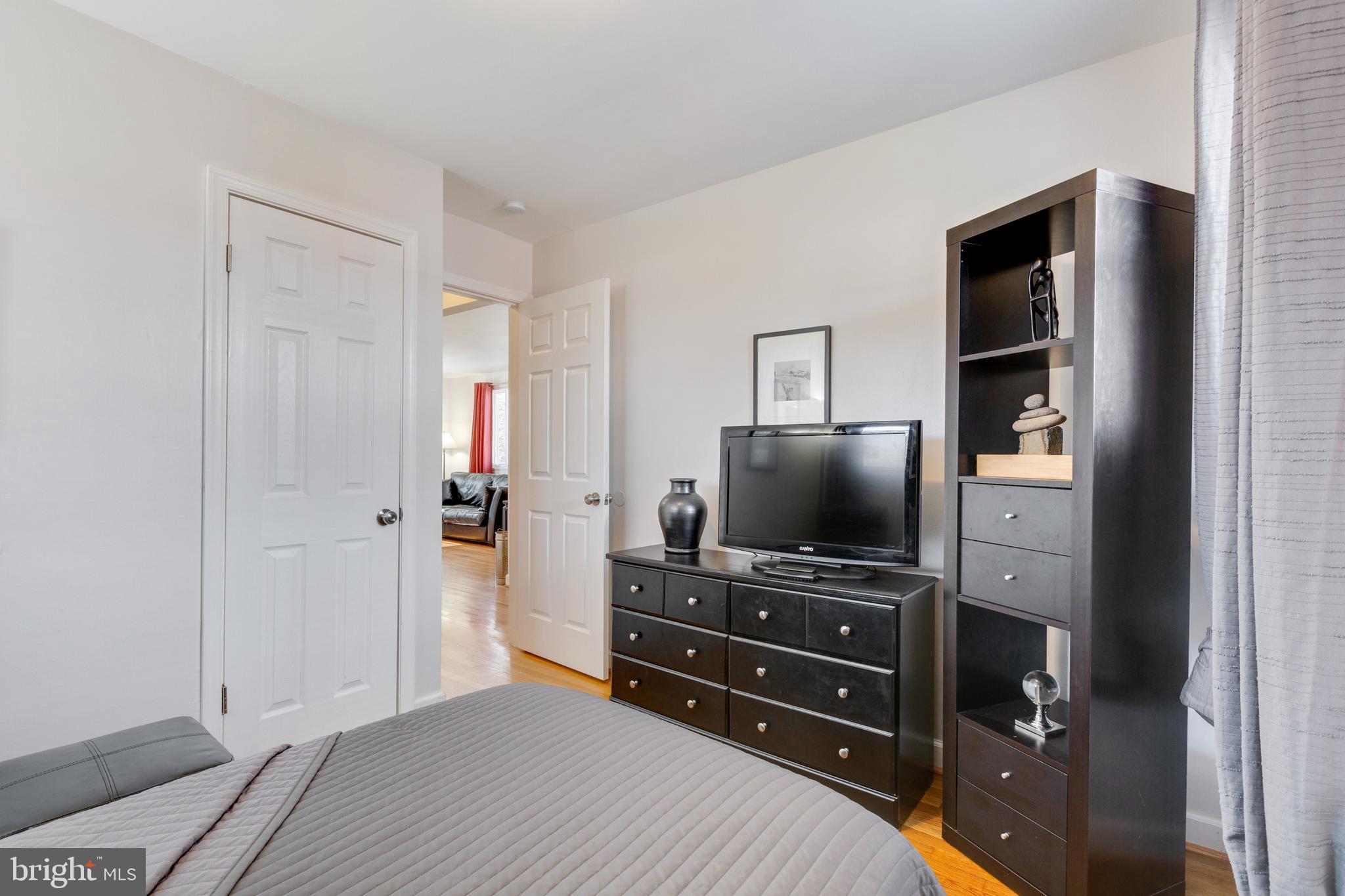 3903 Gannon Road Silver Spring, MD 20902 - Photo 26 of 51 a room with a bed and a flat screen tv