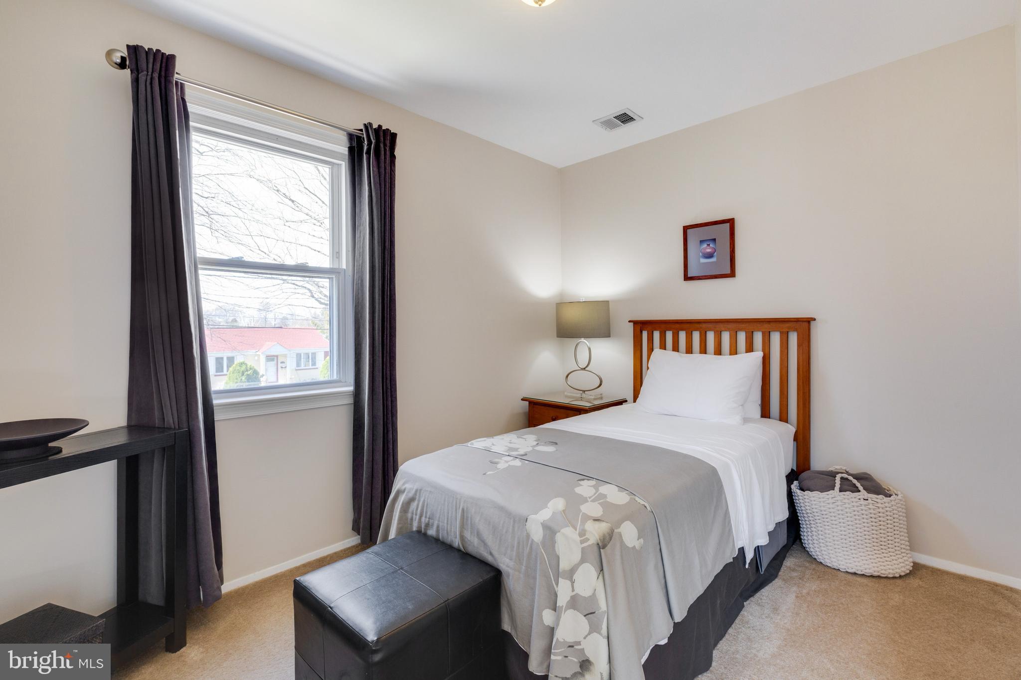3903 Gannon Road Silver Spring, MD 20902 - Photo 28 of 51 a bedroom with a bed and a window