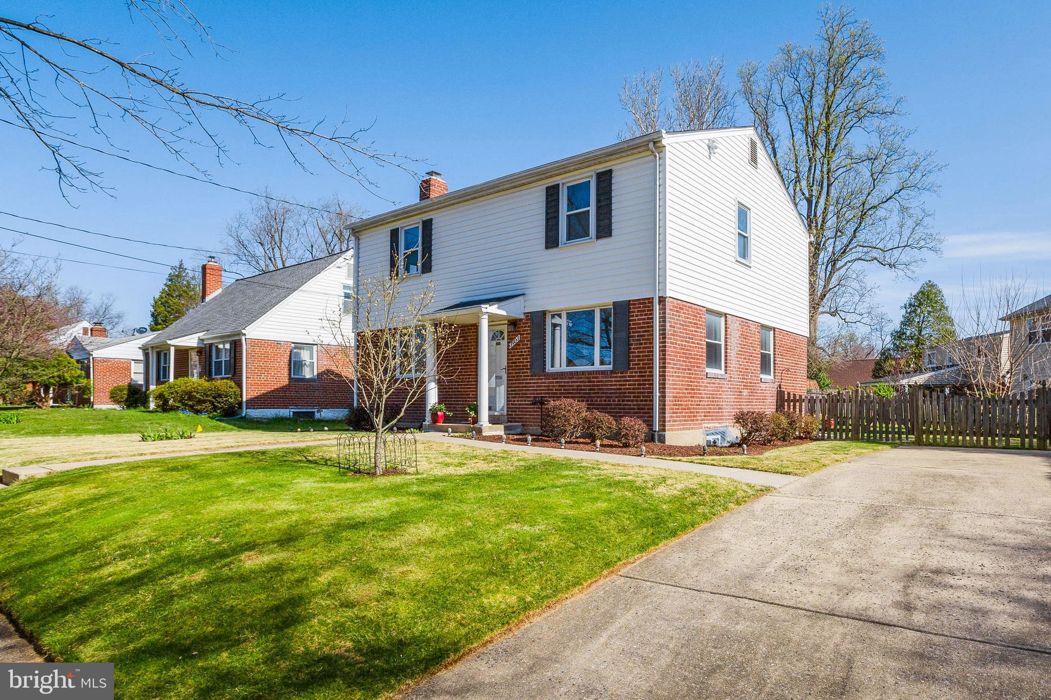 3903 Gannon Road Silver Spring, MD 20902 - Photo 3 of 51 a view of a white house with a big yard and large trees