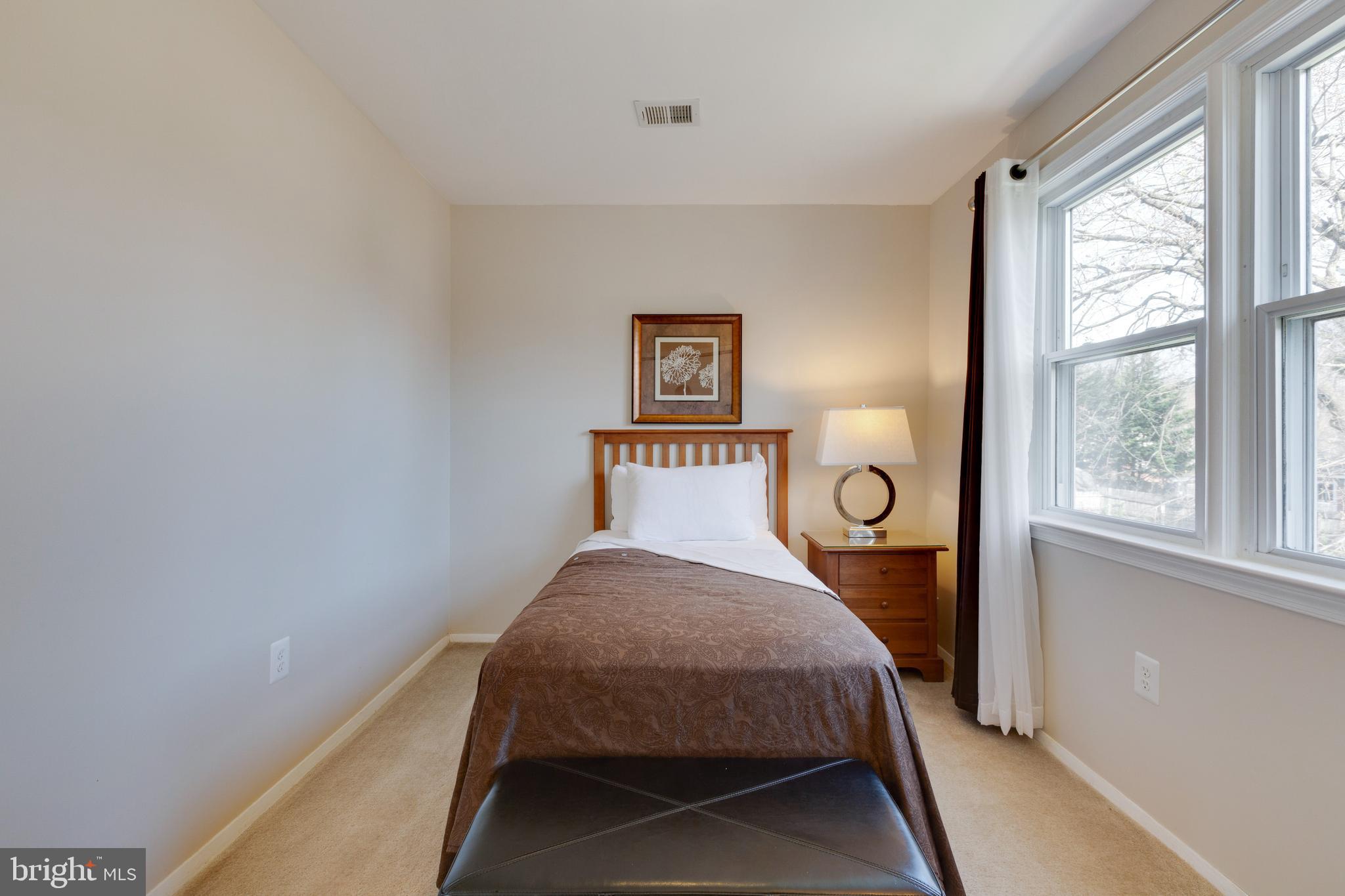 3903 Gannon Road Silver Spring, MD 20902 - Photo 32 of 51 a bedroom with a bed and window