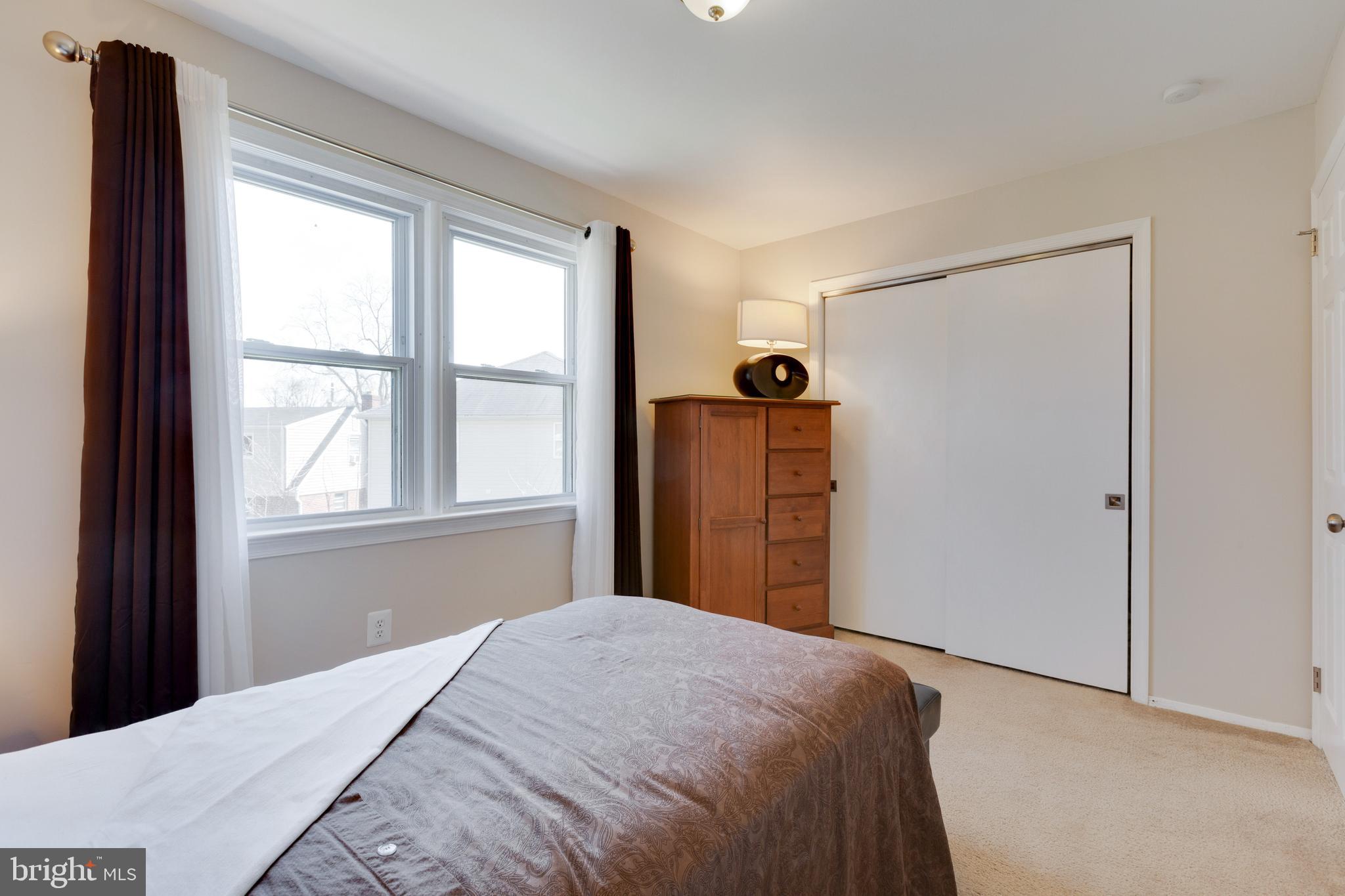3903 Gannon Road Silver Spring, MD 20902 - Photo 33 of 51 a bedroom with a bed and a window