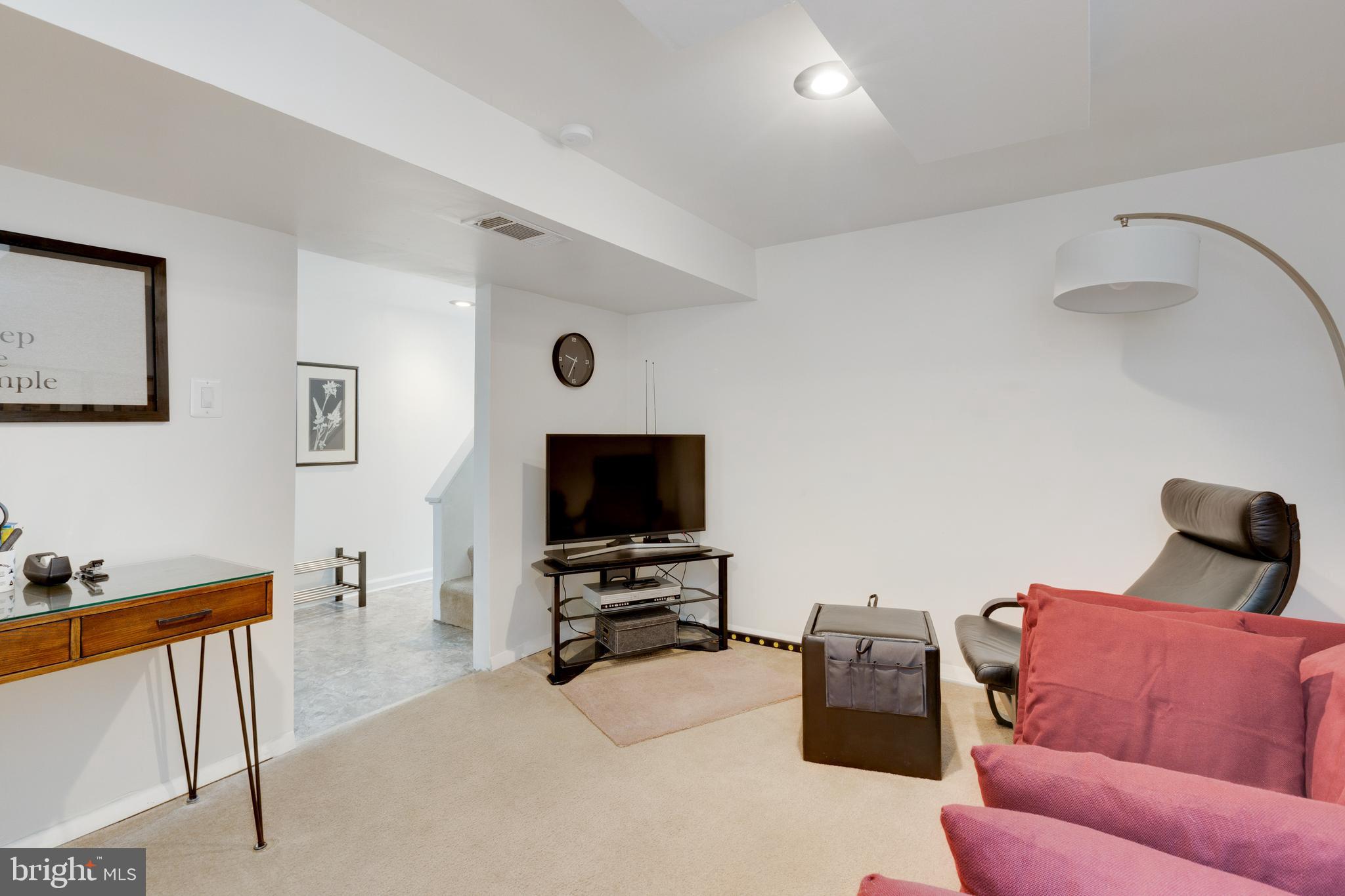 3903 Gannon Road Silver Spring, MD 20902 - Photo 39 of 51 a living room with furniture and a flat screen tv