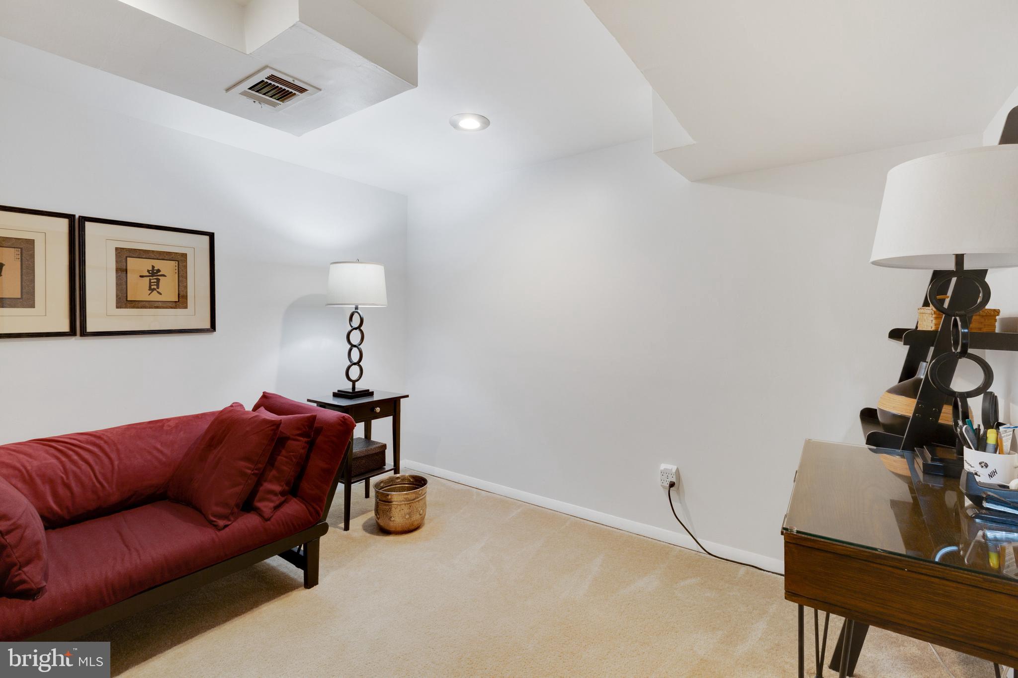 3903 Gannon Road Silver Spring, MD 20902 - Photo 41 of 51 a living room with furniture a flat screen tv and a lamp