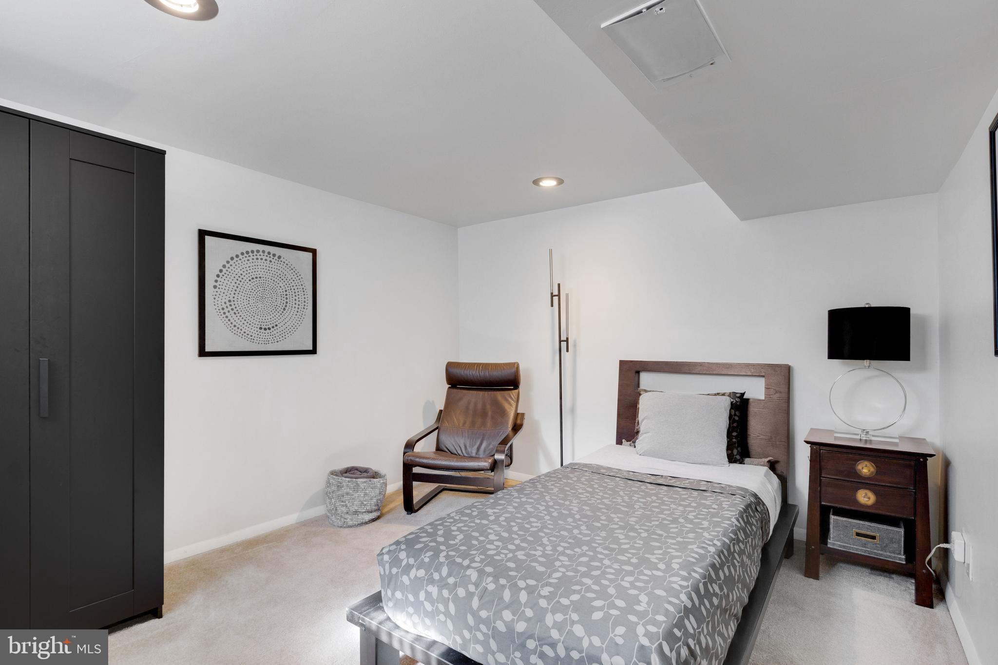 3903 Gannon Road Silver Spring, MD 20902 - Photo 42 of 51 a bedroom with a bed and a chair