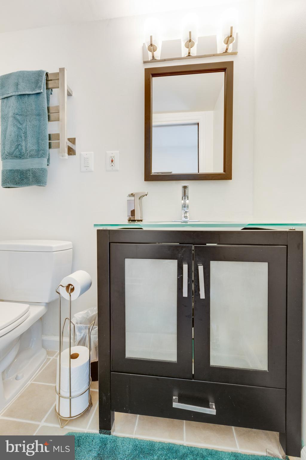3903 Gannon Road Silver Spring, MD 20902 - Photo 45 of 51 a bathroom with a toilet sink and mirror
