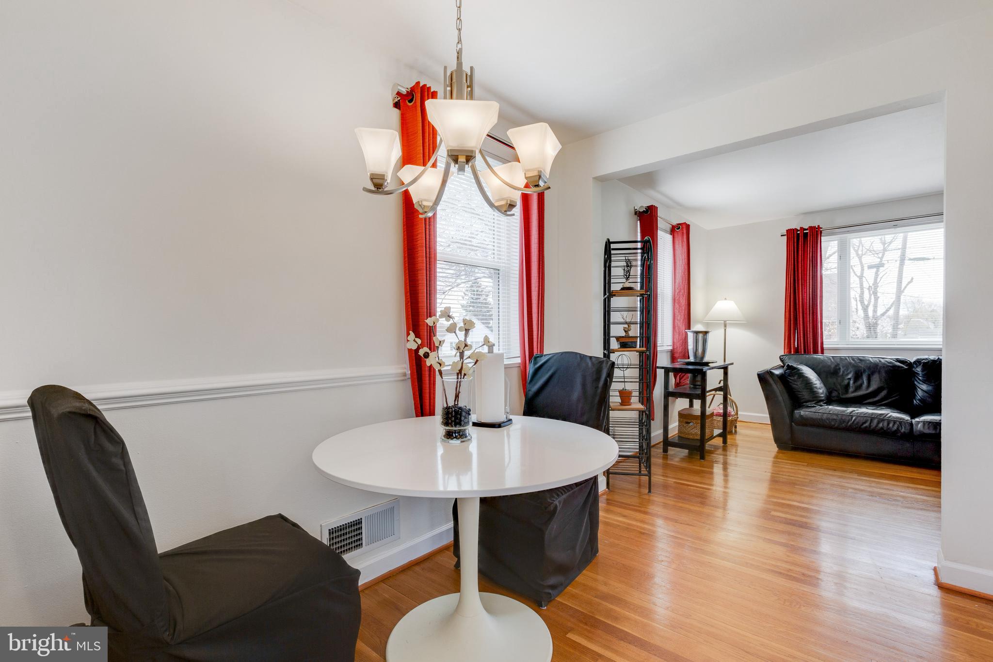 3903 Gannon Road Silver Spring, MD 20902 - Photo 6 of 51 a living room with furniture a chandelier and a wooden floor