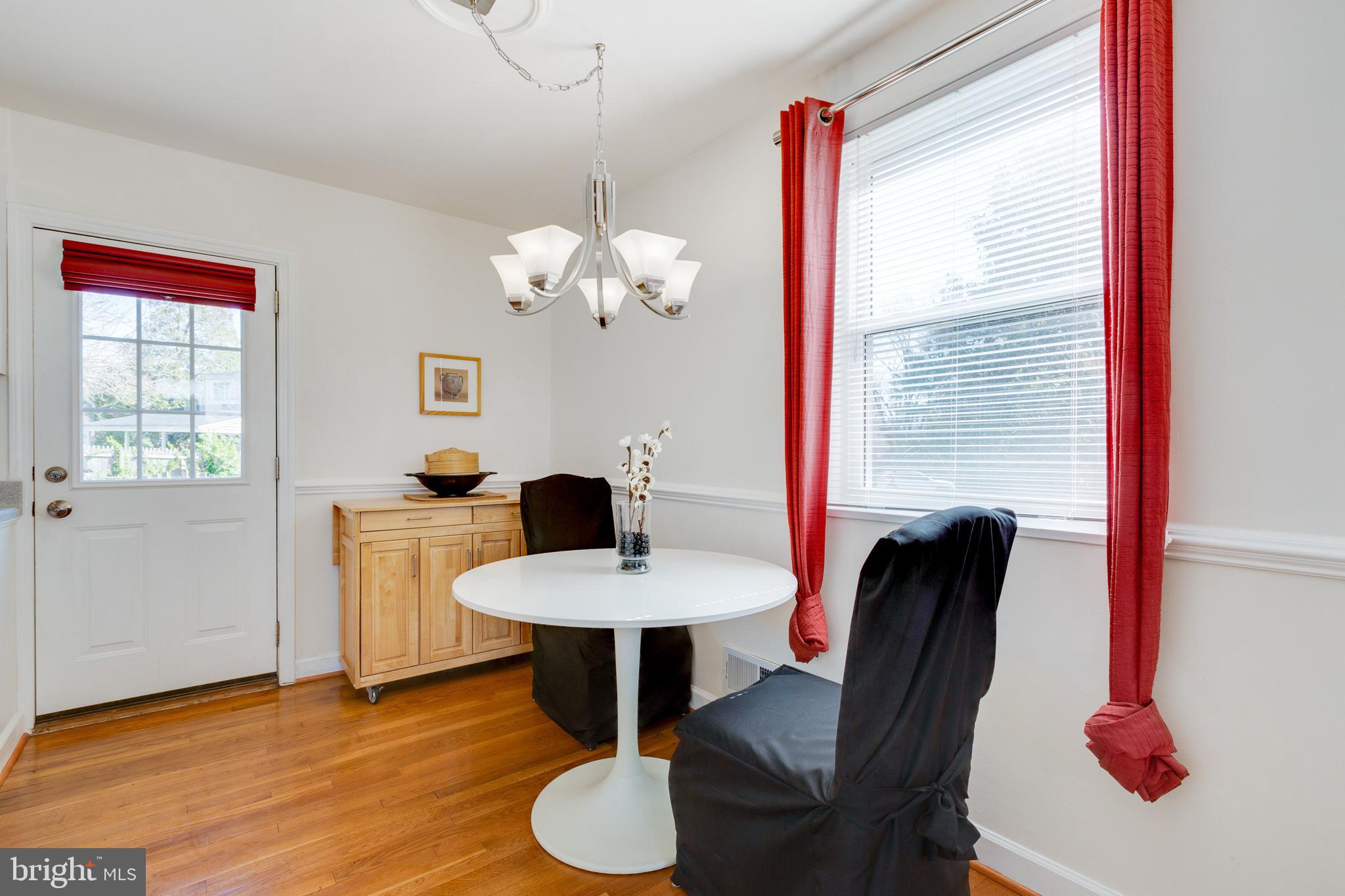 3903 Gannon Road Silver Spring, MD 20902 - Photo 7 of 51 a view of a dining room with furniture and wooden floor