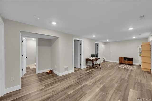 a living room with furniture and a table
