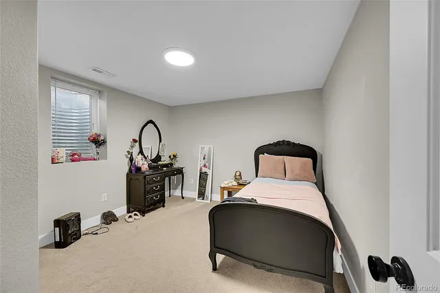 a room with a bed and a gym equipment