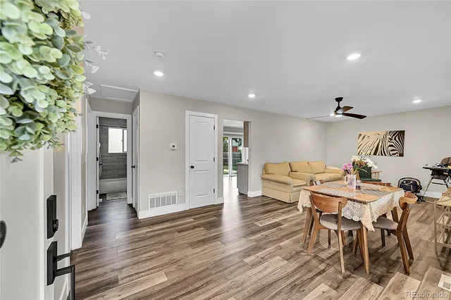 a view of a dining room with furniture window and wooden floor