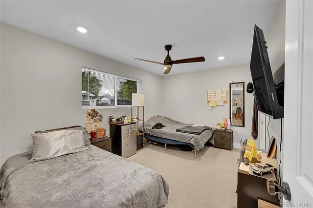 a bedroom with furniture and a window