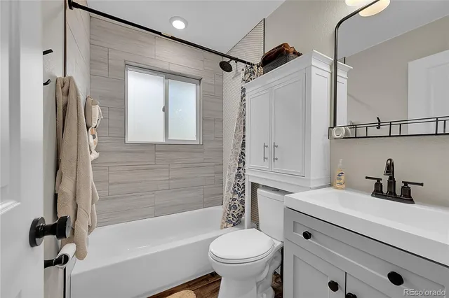 a bathroom with a sink a toilet and a bathtub