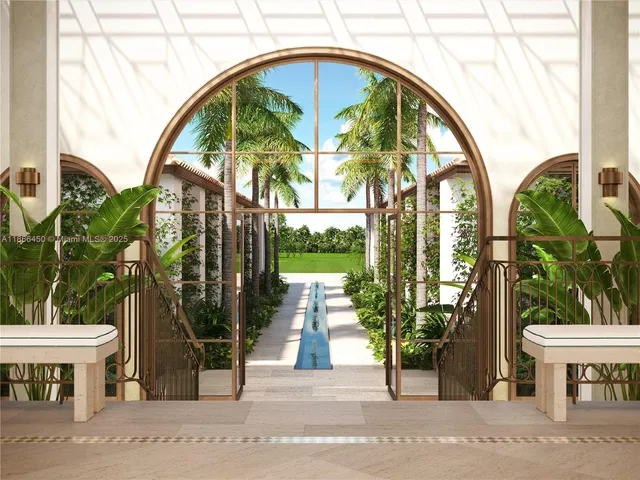 a living room with furniture a lamp and a potted plant