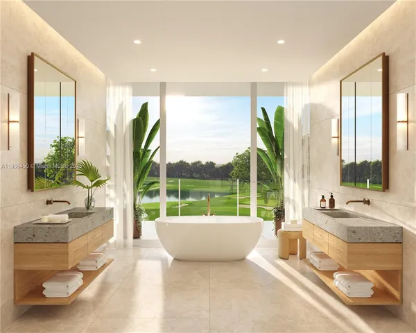 a spacious bathroom with a large tub and sink