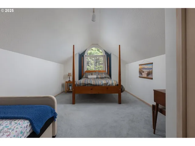 a bedroom with furniture and a window