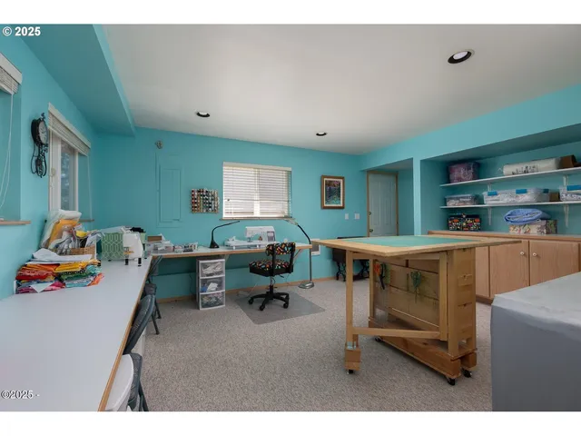 a workspace with furniture and a window