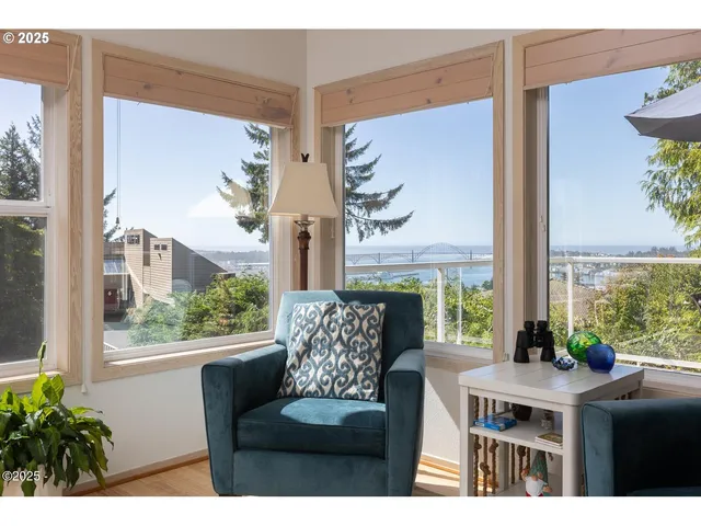 a view of a dining room with furniture window and outside view