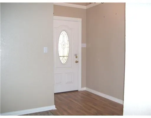 a view of a livingroom with wooden floor