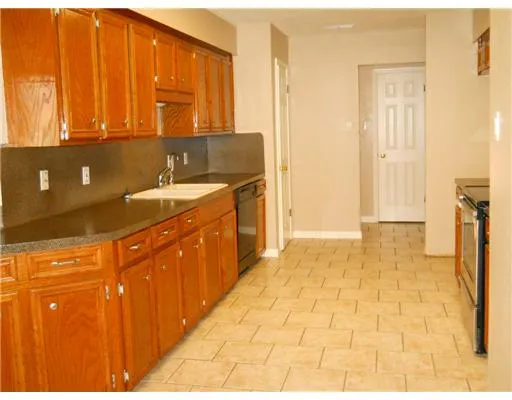 a bathroom with a sink a mirror and a shower