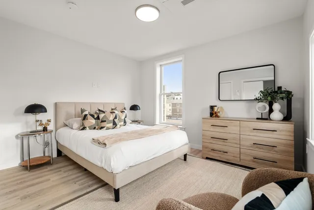 a bedroom with a bed and window