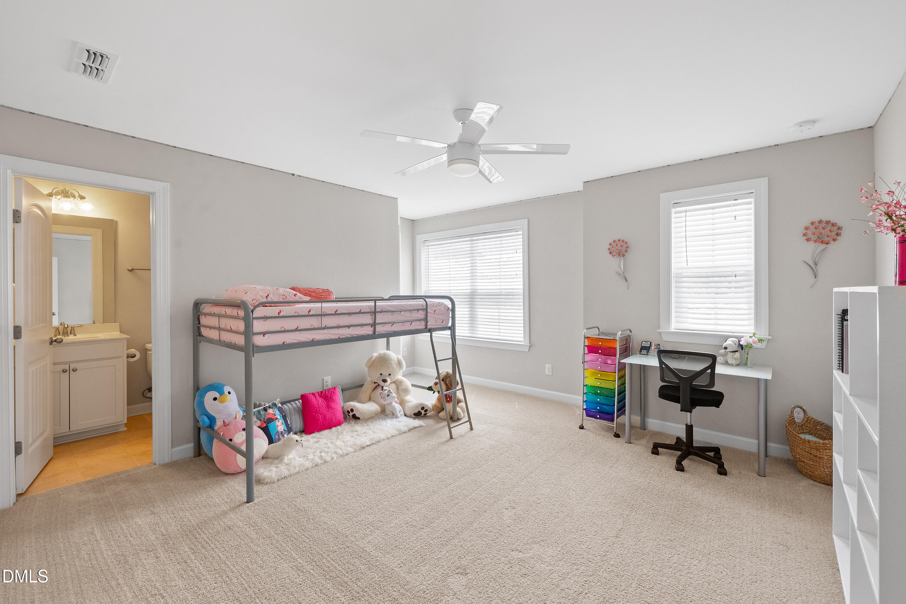 8059 Gilano Drive Raleigh, NC 27603 - Photo 34 of 43 a bedroom with bed and a chandelier
