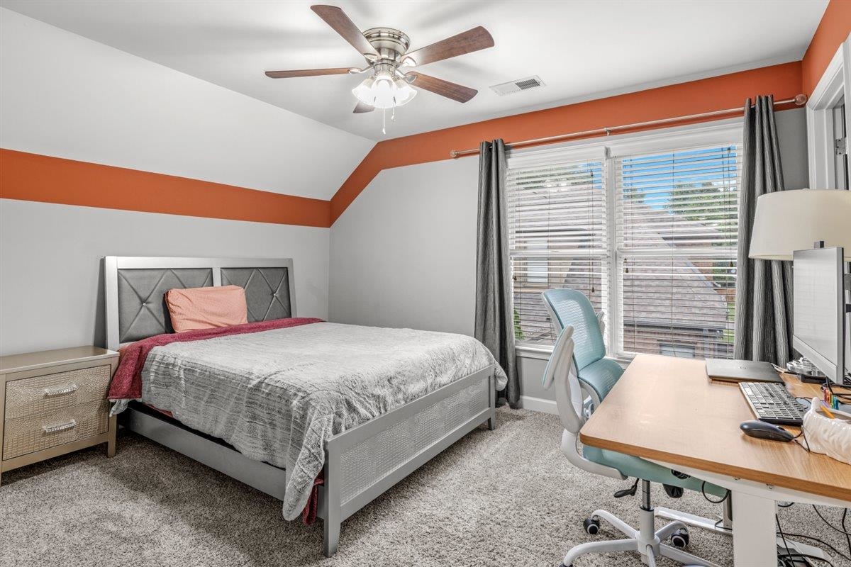 744 Southern Home Road Collierville, TN 38017 - Photo 14 of 24 Carpeted bedroom featuring a sloped ceiling with a ceiling fan