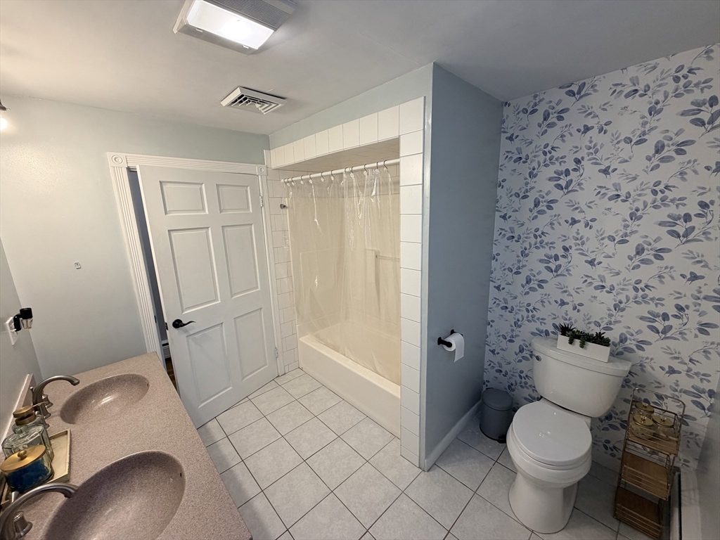 361 South Main Street Bellingham, MA 02019 - Photo 18 of 28 a bathroom with a toilet and a shower