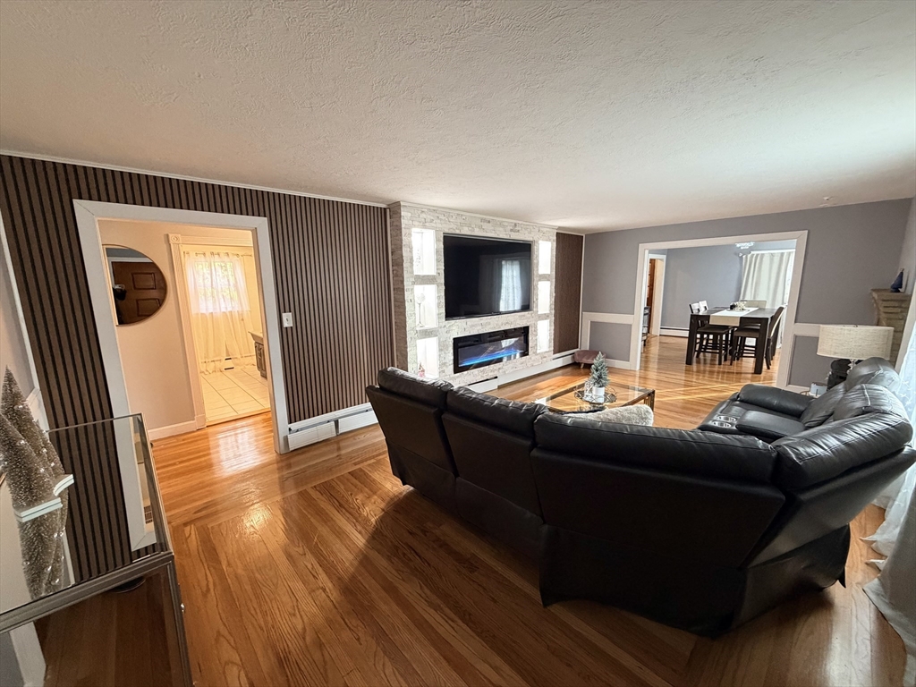 361 South Main Street Bellingham, MA 02019 - Photo 5 of 28 a living room with furniture and a flat screen tv