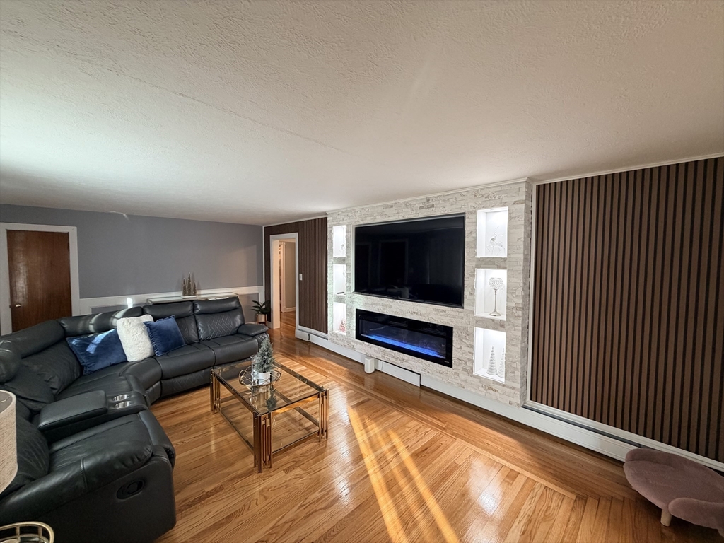 361 South Main Street Bellingham, MA 02019 - Photo 6 of 28 a living room with furniture and a flat screen tv