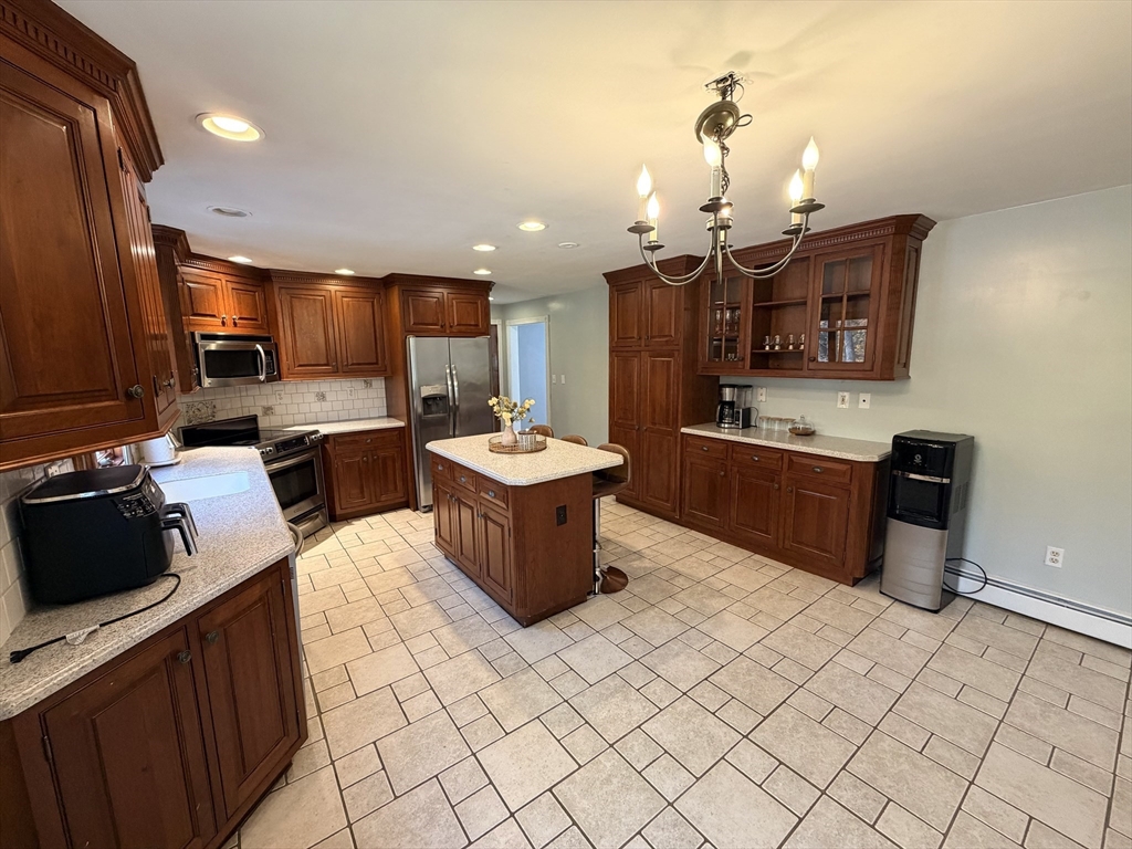 361 South Main Street Bellingham, MA 02019 - Photo 10 of 28 a kitchen with a sink counter top space and appliances