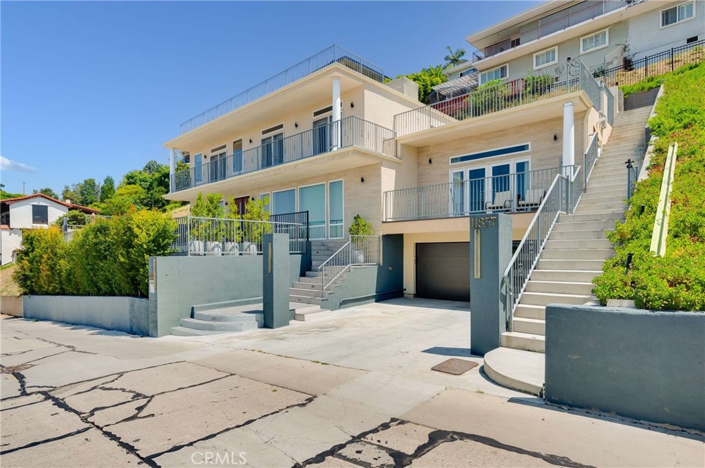 11837 Rideout Way Whittier, CA 90601 - Photo 2 of 44 a front view of a house with a garden