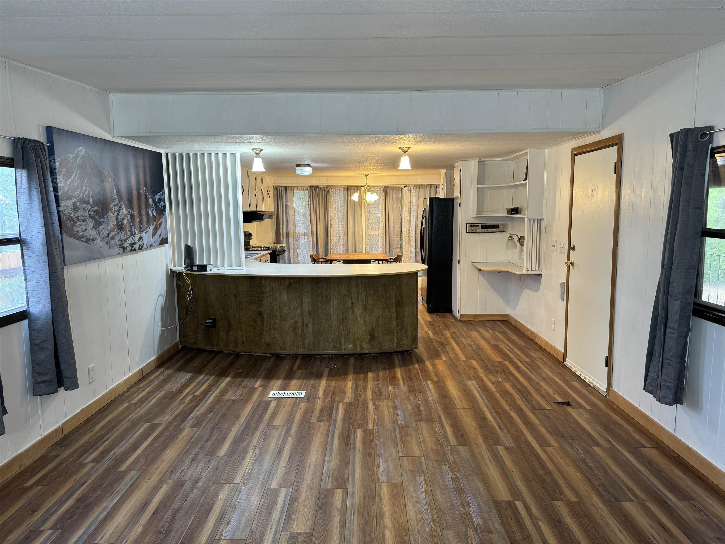 1465 Gemini Circle Fruita, CO 81521 - Photo 2 of 12 a living room with stainless steel appliances wooden floor and a large window