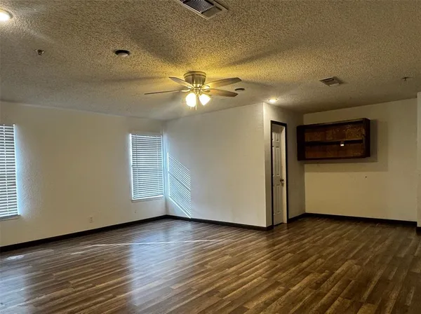 a view of a livingroom with wooden floor