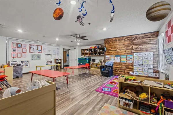 a living room with lots of furniture and kitchen view