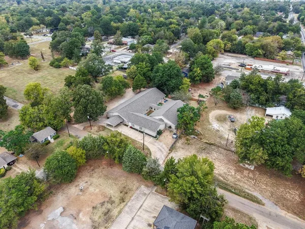 an aerial view of a house with outdoor space and street view