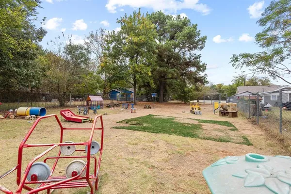 a view of a park with swings and slides