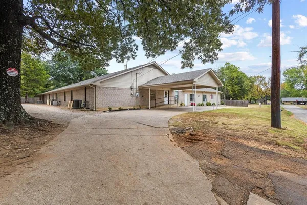 a house with trees in the background