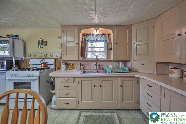 a spacious bathroom with a double vanity sink a mirror and a