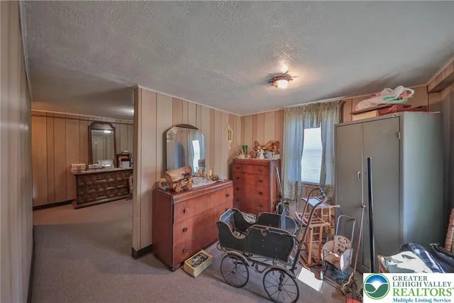 a kitchen with stainless steel appliances kitchen island granite countertop a refrigerator stove and sink